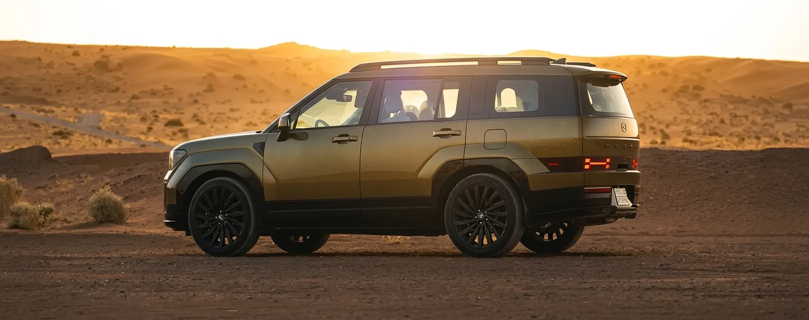 A longer wheelbase adds grandeur, with clean side sculpting, a sleek roofline, and bold wheels framed by robust arches